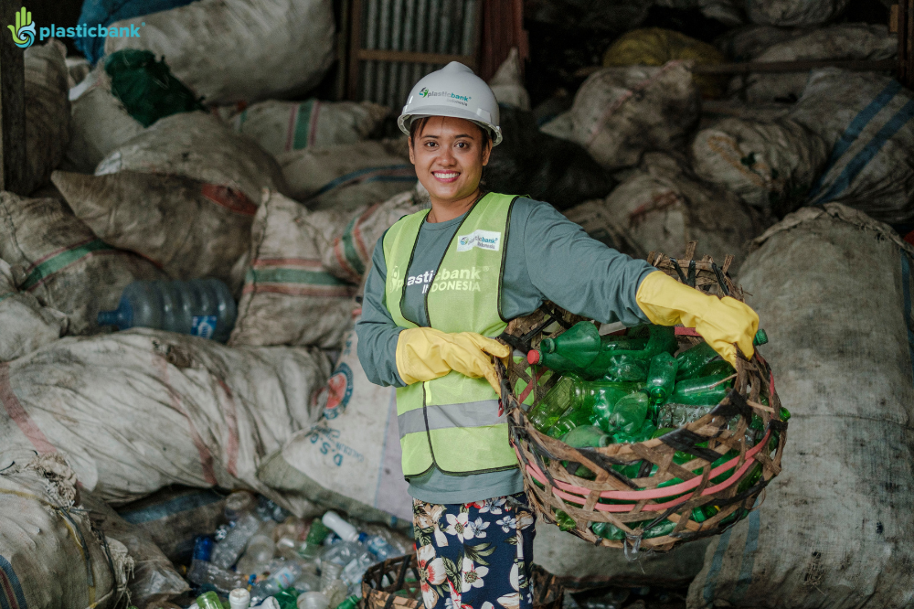 Volunteers collecting ocean plastic as part of Plastic Bank’s environmental cleanup efforts