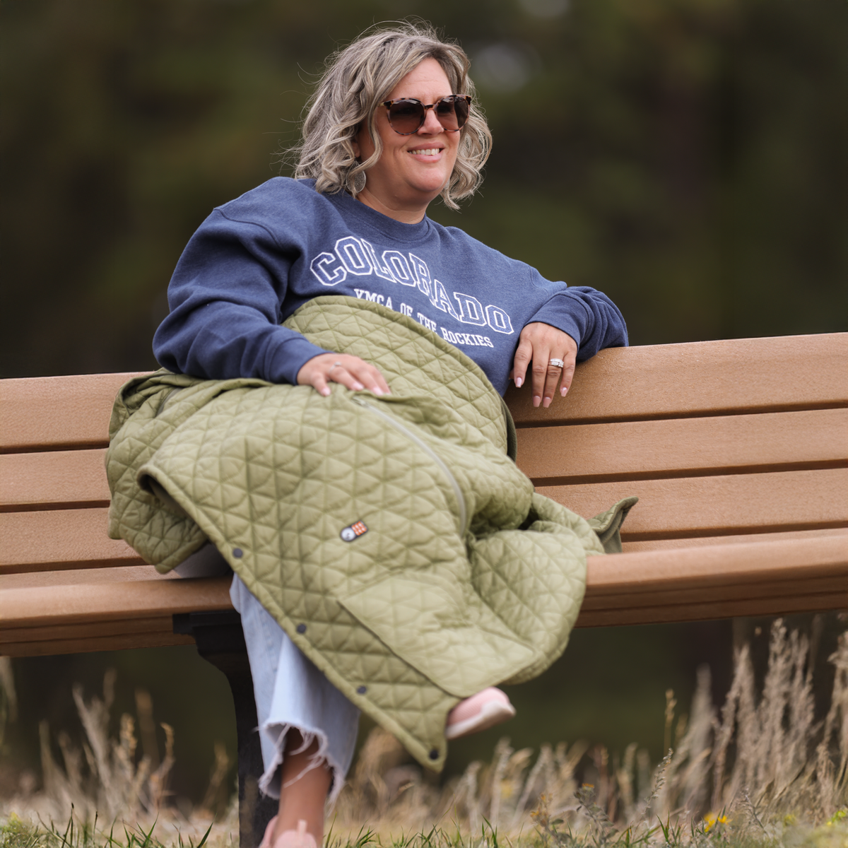 Woman using Cove heated portable blanket outdoors