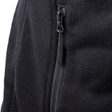 Close-up of a black fleece jacket with zipper detail on a white background