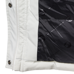Close-up of a white jacket with black lining and buttons.
