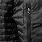Close-up of a black quilted Gobi Heat Polaris jacket with a zipper