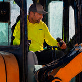 Man in a hi-vis yellow GOBI Helio UPF Sun Hoodie and trucker cap operating a forklift on a job site.